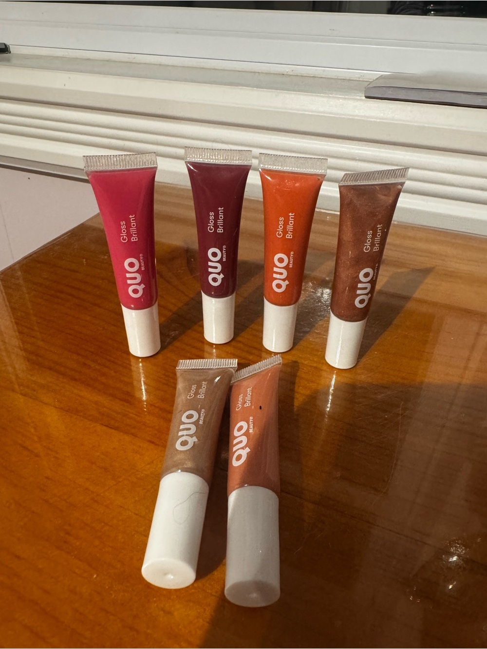 QUO lip gloss